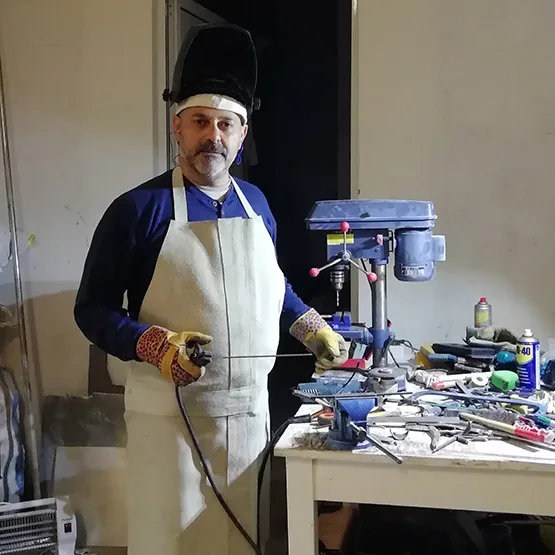 Elio Haddad in the studio, welding a sculpture